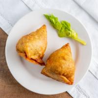 Samosa · Fried pastry with filling of potato and peas. Comes with Red and Green Chutney.
