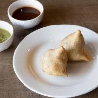 Chicken Samosa · Fried pastry with filling of spicy ground chicken and peas. Comes with Red and Green Chutney.