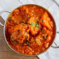 Chicken Vindaloo · Spicy Hot & Tangy Goan style Chicken boneless curry cooked with chili sauce and potatoes.