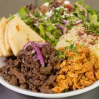 Shawarma Combo · Beef & chicken thinly sliced, served with garlic sauce, shawarma dressing,  grilled pita bre...