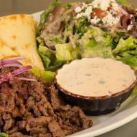 Beef Shawarma Plate · Beef thinly sliced, served with tahini sauce, grilled pita bread & Zayna salad .
