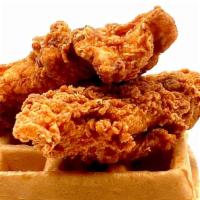 Fried Chicken & Waffles · Two large fried chicken breast tenders served with a buttermilk waffle and syrup