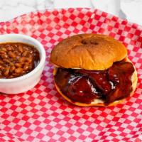 Bbq Brisket Sandwich · Prime brisket chopped with onion pickles and creamy cole slaw on the side. includes choice o...