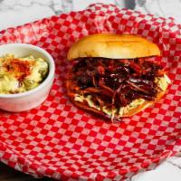 Pulled Pork Sandwich · Includes choice of one side.