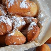 Mini Beignets · 8 bite sized beignets generously dusted with powdered sugar, a side of non-dairy pastry crea...