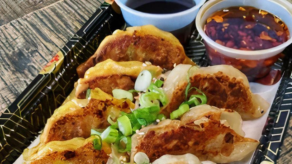 Chicken Gyoza (Potstickers) · 9 pc chicken gyozas, dumpling sauce, chili sauce, soy sauce.