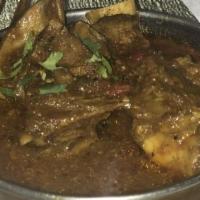 #34. Lamb Curry · Bone in lamb in curry sauce.