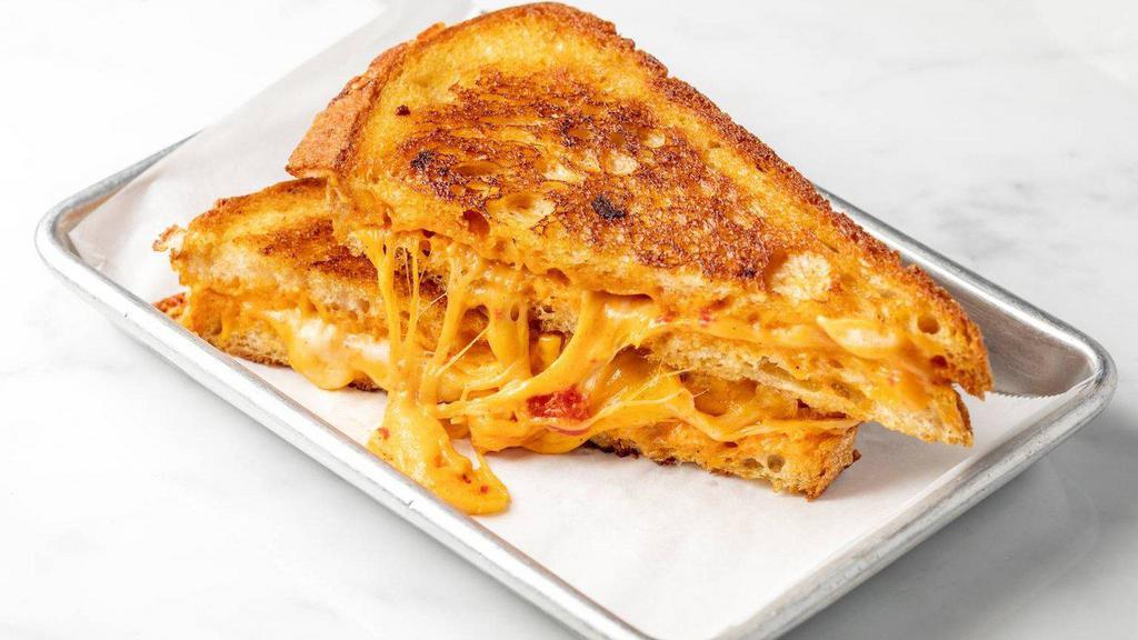 Grilled Cheese · Cheddar cheese on sourdough bread.