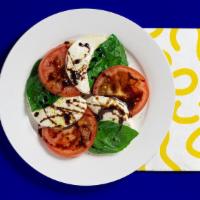 Caprese Salad · Fresh mozzarella, tomato, basil, balsamic vinegar, and olive oil.