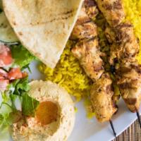 Chicken Kabob · Two skewers of all white chicken breast marinated overnight in spices and herbs.