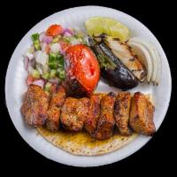 Shish Kabob With Bread · Specially marinated chunks of fillet mignon skewered and charbroiled.