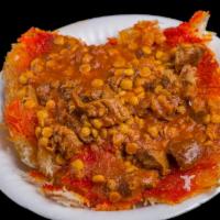 Tahdig With Gheymeh · Tomato based stew over crispy rice.