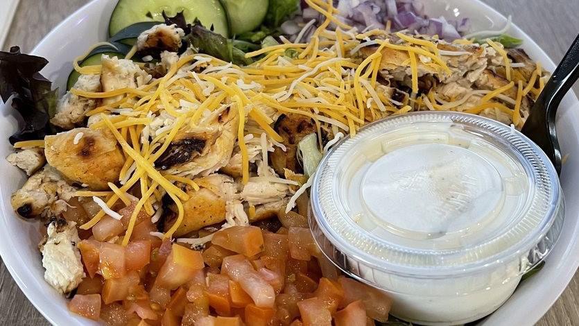 Chicken Salad · Our fresh salad served with choice of fried or grilled chicken.  All salads include a romaine/spring mix, tomatoes, cucumbers, red onions, croutons, shredded cheese and your choice of dressing.