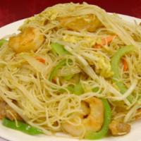 Singapore Noodles · Stir-fried curry flavored rice noodles mixed with egg, chicken, shrimp, bell peppers, yellow...