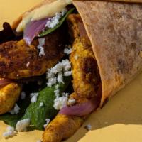 Chicken Shawarma Wrap · The Chicken Shawarma Wrap comes with, garlic hummus, spring mix, made in-house chicken shawa...