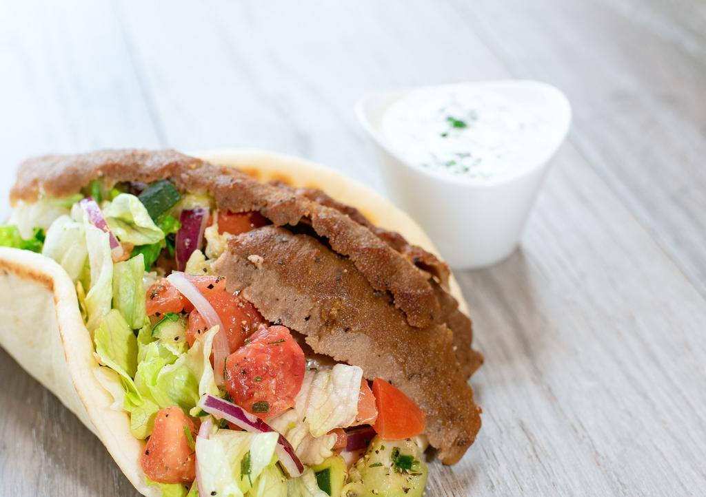 Classic Pita · Hand-carved gyro or grilled chicken, cucumber tomato salad, red onion, lettuce, greek dressing and tzatziki on a warm pita.