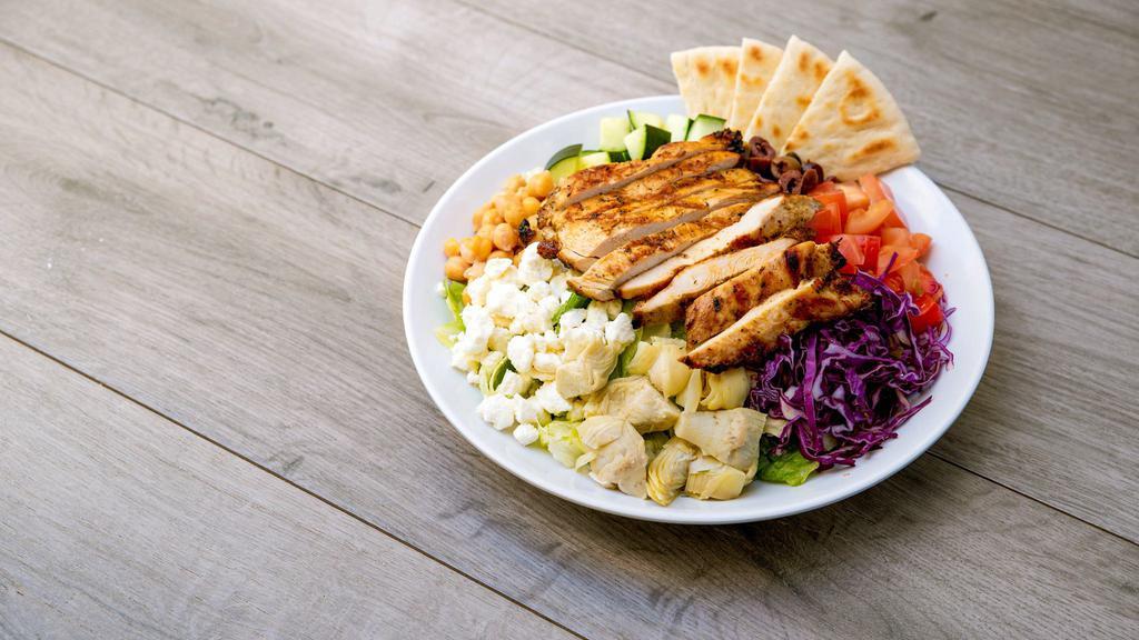 Mediterranean Salad · Mixed greens tossed with lemon tahini dressing, chickpeas, artichokes, tomatoes, cucumbers, red cabbage, feta, kalamata olives, and grilled chicken skewer.