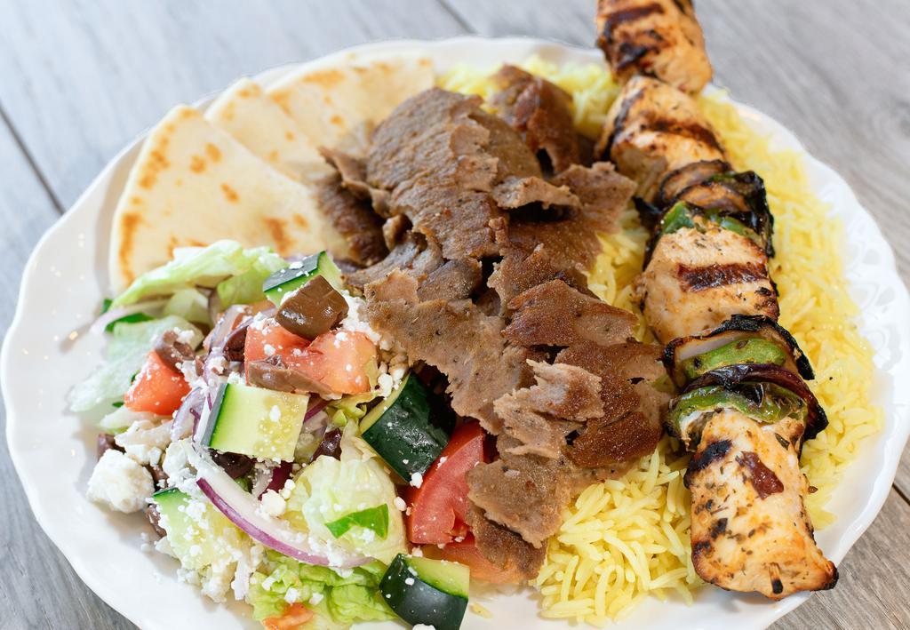 Mix & Match Plate · Your choice of two proteins served with roasted veggies, seasoned basmati rice, choice of hummus or tzatziki, and a warm pita.