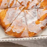 Cinna-Za Pizza · Pizza dough spread with a cinnamon-brown sugar blend and drizzled with icing after baked.