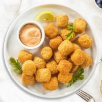 Crispy Tots · (Vegetarian) Shredded Idaho potatoes formed into tots, battered, and fried until golden brown.