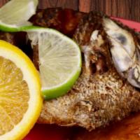 Mojarra · Deep-fried whole tilapia fish served plain alla diabla, ranchera, al mojo de ajo.