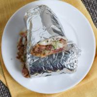 Breakfast Super Burrito · Choice of machaca, chorizo, tocino, jamon, huevos a la mexicana and potatoes with rice, onio...