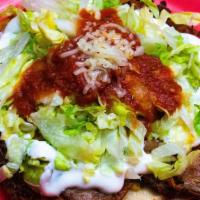 Super Taco · Guacamole, sour cream, cheese, salsa and lettuce.