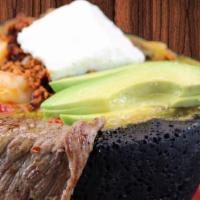 Molcajete · Serve with steak, shrimp, chicken, chorizo cactus, green onions, monterey jack cheese, and a...