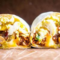 #3 Burrito · Ham, chorizo, bacon, eggs, refried beans, rice, cheese, potatoes, salsa, guacamole, sour cre...