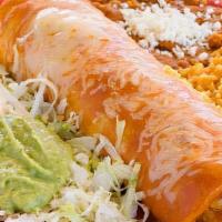 Super Enchilada · 14-inch flour tortilla enchilada with your choice of meat or cheese topped with green or red...