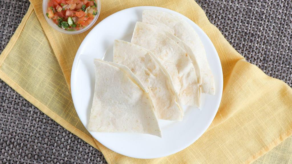 Regular Quesadilla · Two delicious flour or com tortilla with melted cheese.