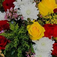 Rose Mix · Hand wrapped dozen, with red and yellow roses with a mix of filler flowers.