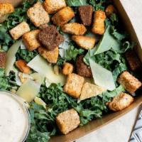 Kale Caesar Salad · Croutons, Parmesan flakes, pepitas.