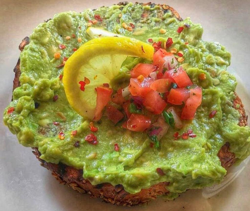 Avocado Toast · Avocado with lemon, pico de gallo, chili pepper flakes, touch of olive oil served on freshly baked sourdough.