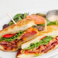 Gourment Grilled Cheese · Proscuitto, Swiss, Cheddar, Arugula, tomato.