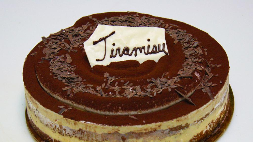 Tiramisu · Contains gelatin. Mascarpone, vanilla sponge, cocoa powder, coffee syrup, whipped cream.