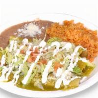 Enchiladas Plate · Three enchiladas served with beans and rice. Enchiladas come with onions, lettuce, sour crea...