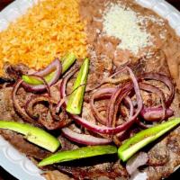 Asada Plate · Delicious carne asada served with grilled onions and jalapeños. Plate includes beans, rice, ...