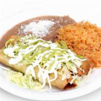 Flautas Plate · Order of beans, rice, and two flautas with lettuce and sour cream on top and side of special...