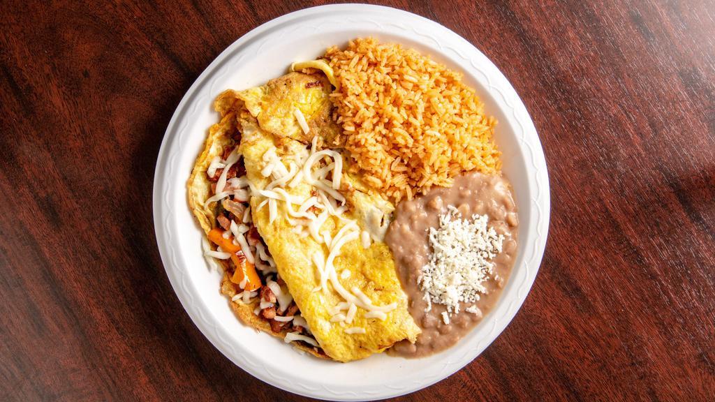 Ham Omelet · Ham omelet with cheese, onion, and bell peppers. Served with beans, rice, and choice of tortillas.