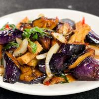 Eggplant With Tofu · Spicy. Eggplant and stir fried with onion, bell peppers, chili, garlic, and basil leaves