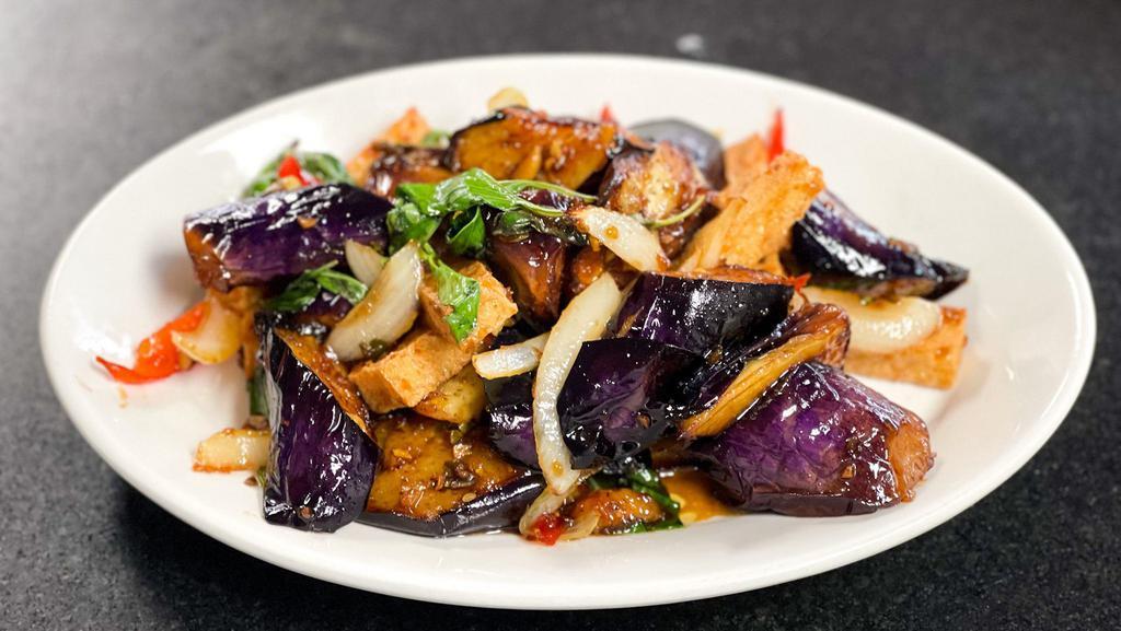 Eggplant With Tofu · Spicy. Eggplant and stir fried with onion, bell peppers, chili, garlic, and basil leaves
