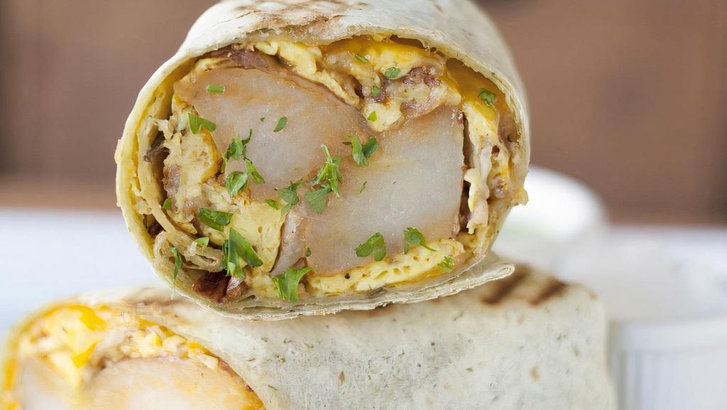 Breakfast Burrito · Choice of chicken, turkey or ham, scrambled eggs, cheddar cheese, black beans, and mushrooms.
