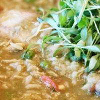 Aguadito De Pollo · Homemade chicken cilantro soup with rice and carrots make from scratch