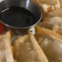 Fried Chicken Potsticker · Oriental crepes with chicken and vegetables served with homemade soy sauce.