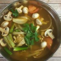 Tom Yum Soup · Thai style hot and sour soup with mushrooms, onion, tomatoes and lemon grass with choice of ...