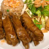 House Bbq Pork Spare Rib · Thai BBQ pork spare rib served with shrimp fried rice, green salad and vegetable egg roll.