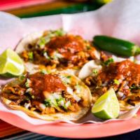 Tacos · Meat, fresh onions, cilantro, & taco sauce