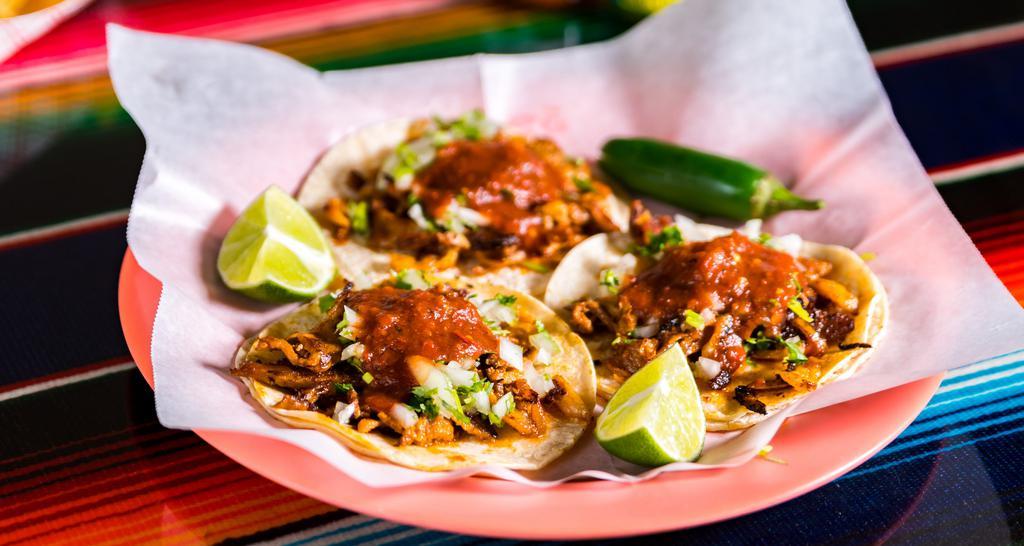 Regular Tacos · Meat, onions, cilantro, and salsa.