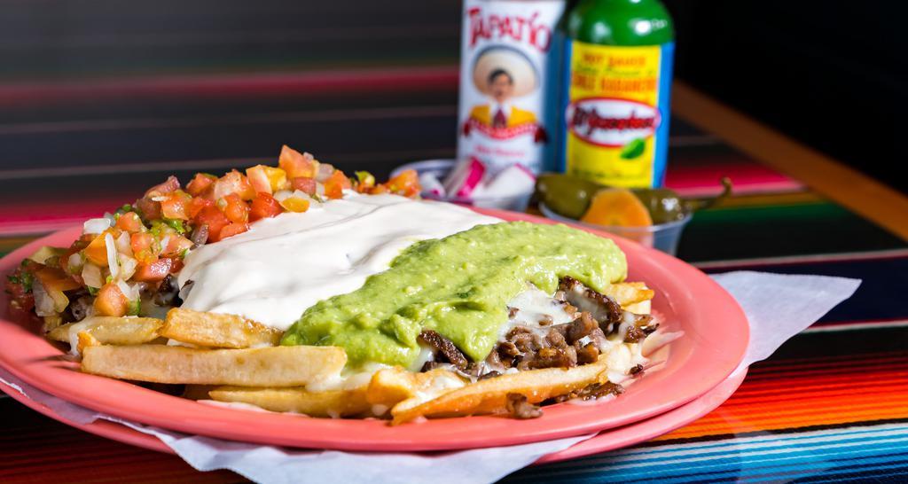 Carne Asada Fries · French fries with carne asada or your choice of meat with beans, cheese, sour cream, guacamole, and salsa.